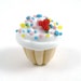 Multi Colored Sprinkles and a Red Heart Top this Handmade Vanilla Glass Cupcake Bead