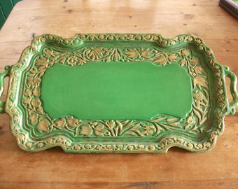 Solid wood carved tray, painted, distressed and enhanced with gold leaf.