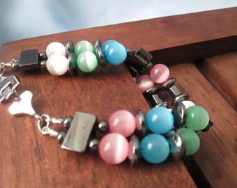 Handmade Two Strand Bracelet-Hematite 2 hole spacers - Moon Glow Beads Multi colors.- hook closure-Length 6 1/2"- Childs & Women's Bracelet
