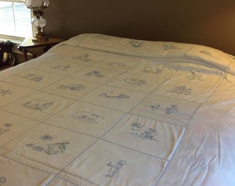 Embroidered nursery rhyme coverlet