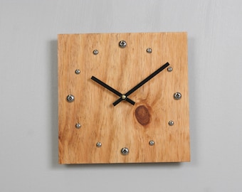 Plywood clock with stainless steel hour markers and Tung oil finish. USPS priority shipping to USA ncluded