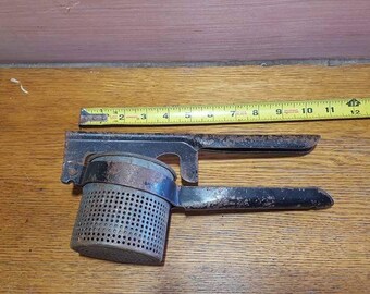 Vintage hand potato ricer / juicer fruit strainer