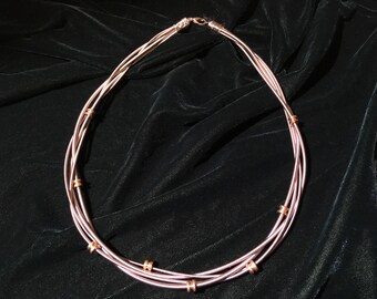 Bass guitar string and string nut necklace