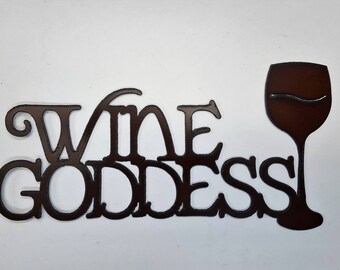 Wine Goddess sign made out of rusted metal