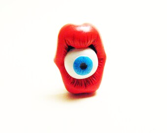 Mouth and eye blue lapel pin