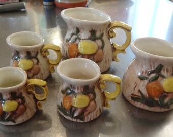 Arnel's mushroom measuring cups - ceramic set of five (5) - brown orange yellow green figural mushrooms and bark kitsch and quite cute!