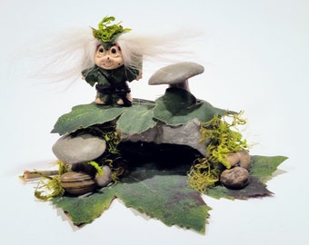 Mini, Troll, a mythical, cave-dwelling being depicted in folklore as either a giant or a dwarf, typically having a very ugly appearance