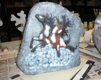 Hand painted horses on a ceramic rock