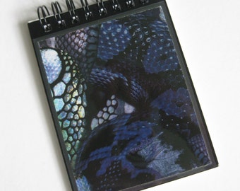 Alexander McQueen A7 (11x8cm) spiral-bound notebook made with "Black Snake' print paper.