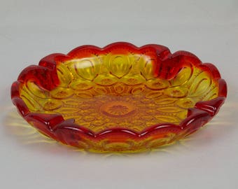 Round Ashtray Gold to red pressed glass 8 1/2 inches in diameter Perfect condition Amberina colored glass