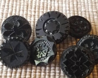 Vintage Buttons - lot of 7 jet black, pressed assorted designs Victorian, (lot oct 123 17)