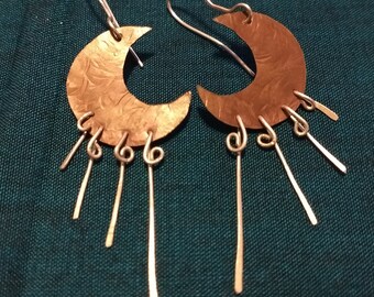 Crescent shaped dangly earrings