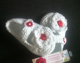 a pair of 100% cotton crochet baby shoes