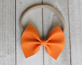 Orange faux leather bow