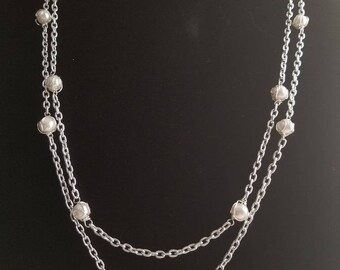 Wire wrapped white glass beads, delicately suspended in chain