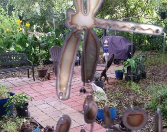 Dragonfly wind chime with many circles for the garden sounds wonderful