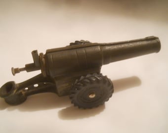 Toy canon with firing pin and calside