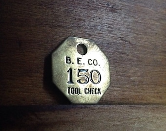 Vintage Brass B. E. Co. Tool Check Tag. Number 150. Industrial Craft Supplies.