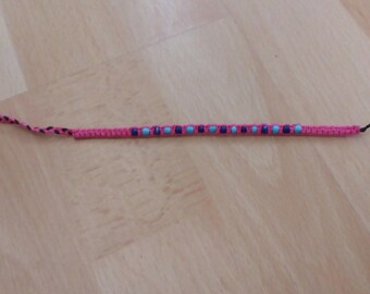 Pink braided beaded bracelet