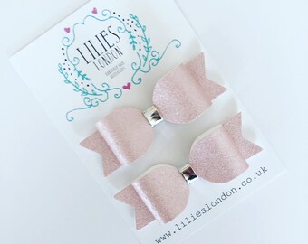 Shimmery pink pigtail clips