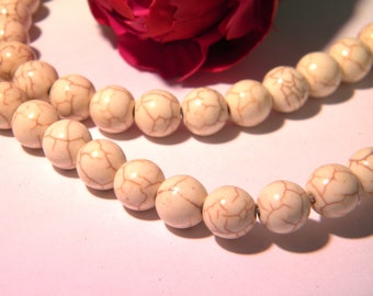 25 beads summary - ivory - 10 mm howlite with visible crazing - H36