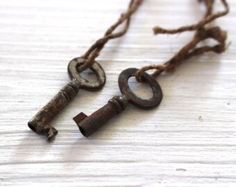 Pair of tiny vintage rusty keys