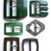 Different vintage, green or khaki color, rectangular shape or diamond belt buckles plastic material