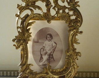 Bronze photo frame. Antique photo frame with a rocaille decor. Louis XV style.