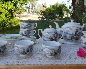 Vintage Hakusan China tea set with snack plates, made in Japan. Pagoda scene.
