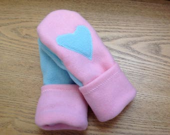 With love for the holidays mittens in pink and blue with hearts