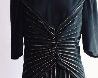 Welted black party dress in gold