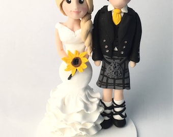 Polymer clay personalised wedding cake topper. Groom and bride