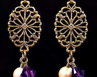 Antiqued brass and pearl earrings.