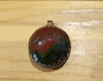 Brass framed stone cabochon, bloodstone