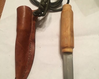 Grapewood knife and leather sheath with strap.