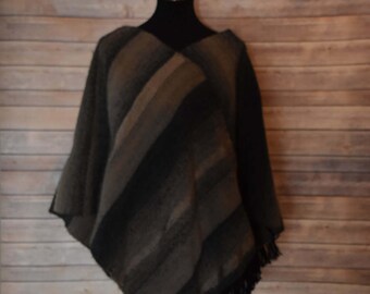 Warm, handwoven poncho in taupe, grey and black.