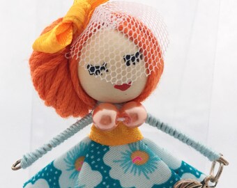 Doll brooch