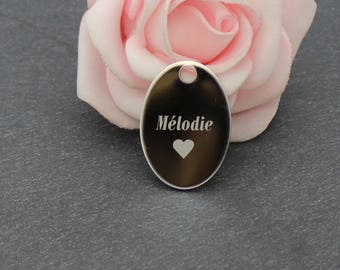 An Oval Pendant in stainless steel + laser engraving
