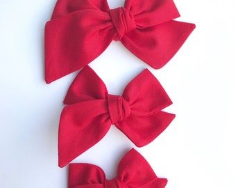 Red hand tied bow •large, medium, or small• headband or hair clip