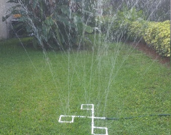 Outdoor Water Play Sprinkler Fun for Kids. Includes the 4-way Hub and 3 attachments with all connectors and plugs.