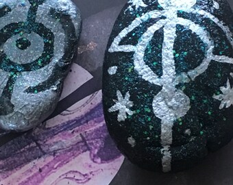 Celestial runes on painted pebbles
