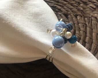 Napkin or Napking rings of silver ring with stones in blue