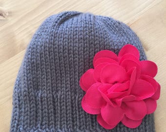 Newborn baby girl hat with pink flower.