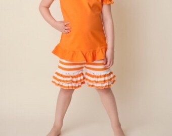 Girls orange and white striped ruffle shorts