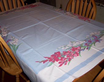 Blue vintage tablecloth with Gladiolas