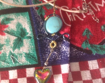 Wire wrapped pendant with turquoise and heart