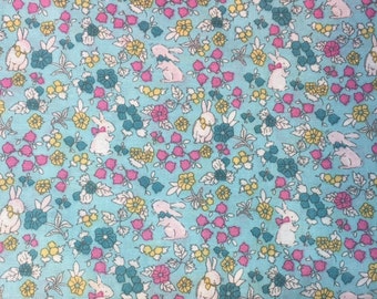 Aqua Cotton Fabric Covered with Bunnies and Flowers