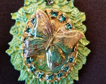 Necklace, Butterfly. Collage pendant, Butterfly, blue rhinestone and resin pendant, leather backed.