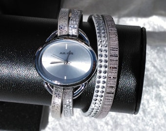Gray and white strap watch with cuff