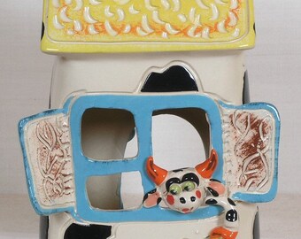 This is a houses on a hill ceramic miniature.